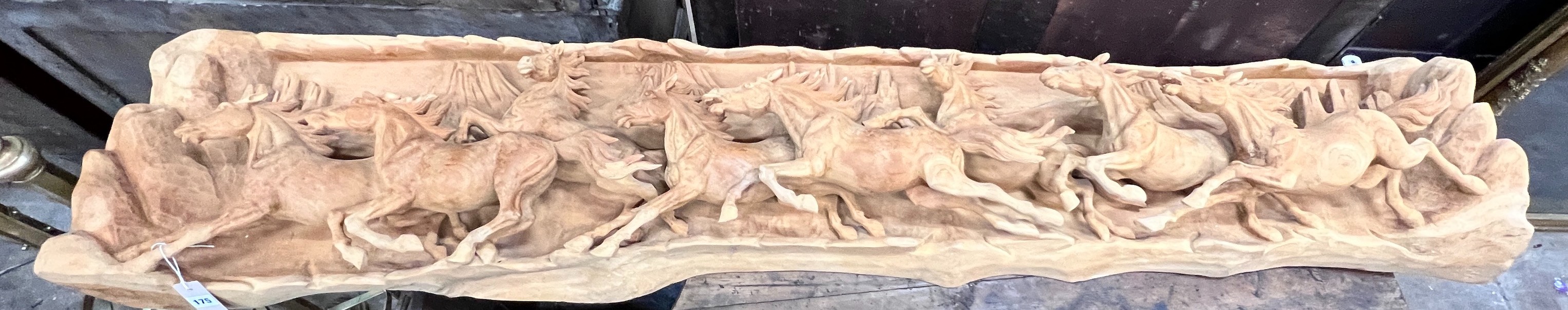 An unusual, probably American, carved wood panorama of eight galloping horses, width 200cm, height 46cm *Please note the sale commences at 9am.